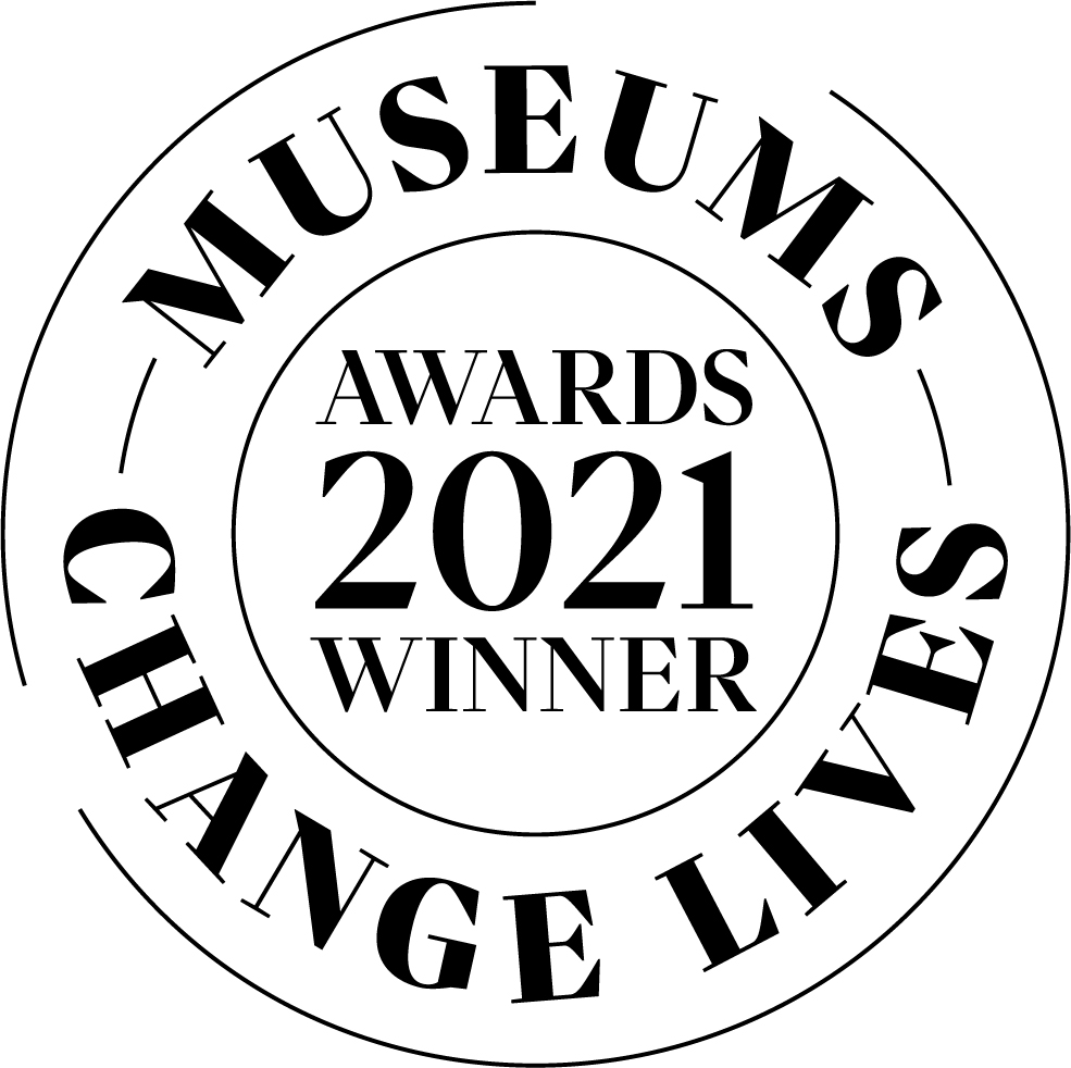 Black text on white background of a square logo with text reading " Museums Change Lives" and "Awards 2021 winner"